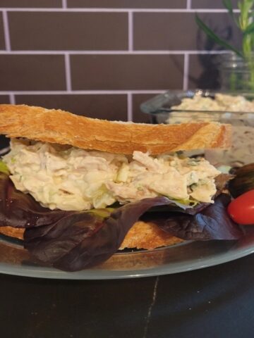 plated chicken salad sandwich, cherry tomatoes