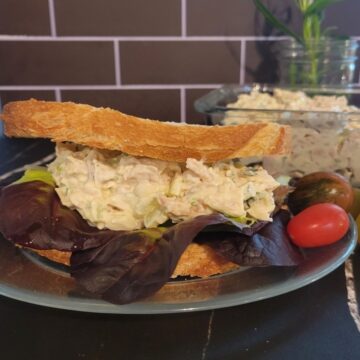 plated chicken salad sandwich, cherry tomatoes
