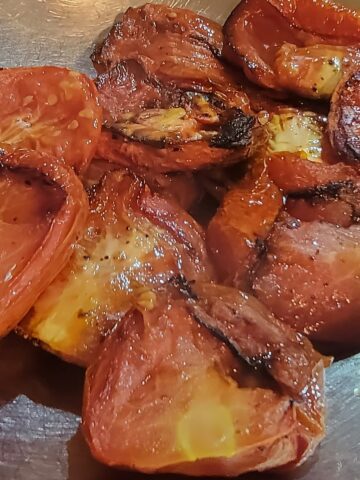 finished roasted tomatoes shown in mixing bowl