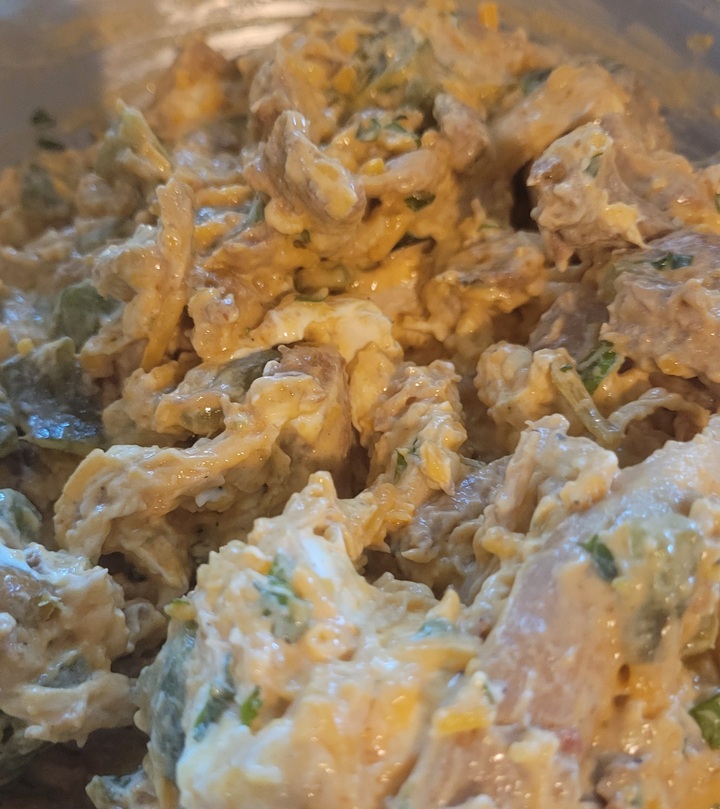 chicken enchilada casserole filling mixed together in bowl