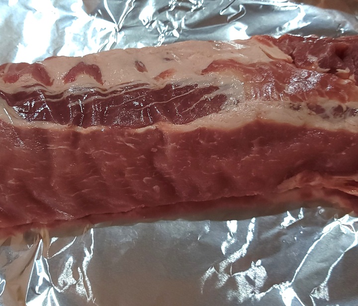 raw rack of  baby back ribs