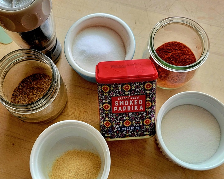 spices for ribs; salt, cayenne, sugar, granulated garlic, coriander, black pepper in grinder, smoked paprika in can