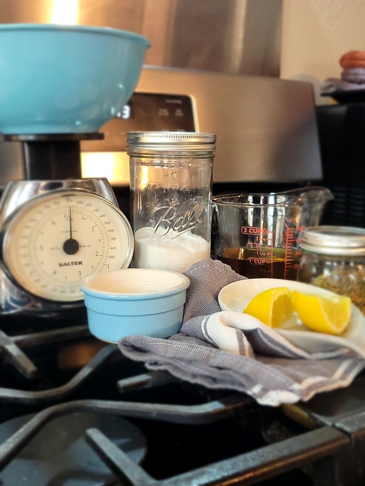 ingredients for brine, lemon, sugar, salt, vinegar, spices. kitchen scale and bowl
