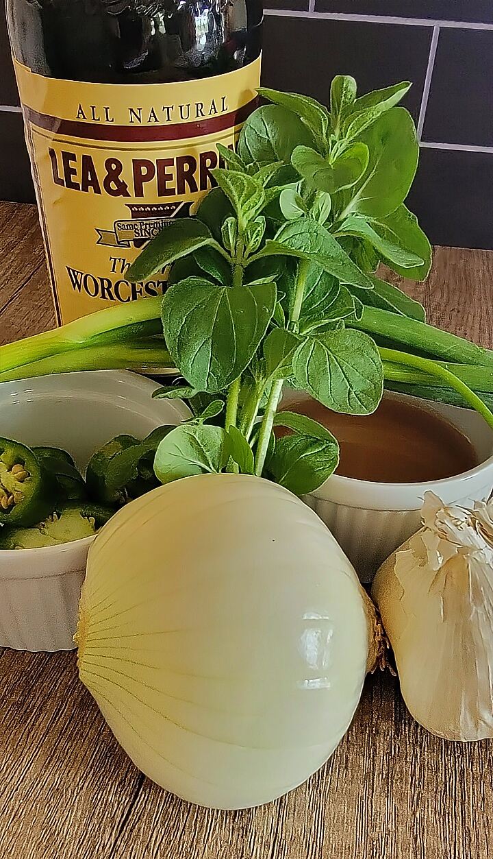 ingredients for marinade; yellow onion, garlic, jalapeno, cider vinegar, green onion, worcestershire sauce