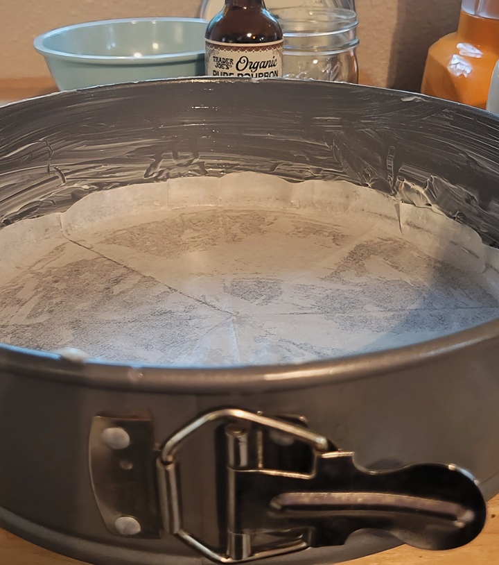 buttered springform pan with bottom lined with parchment paper