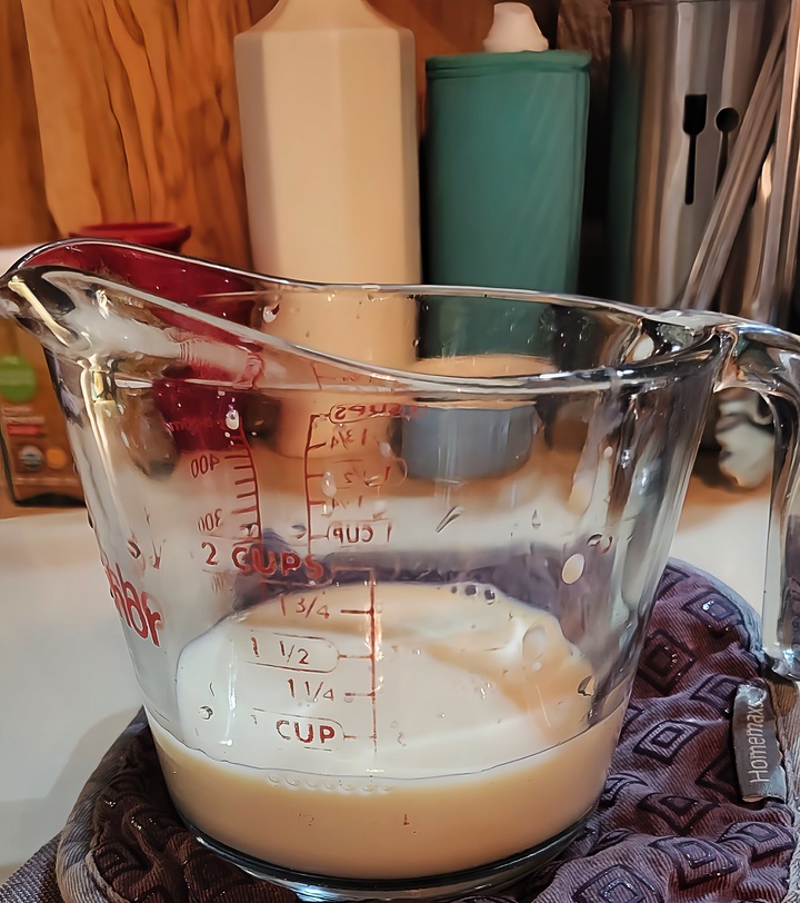 soy milk shown as measured in a measuring cup, ½ cup