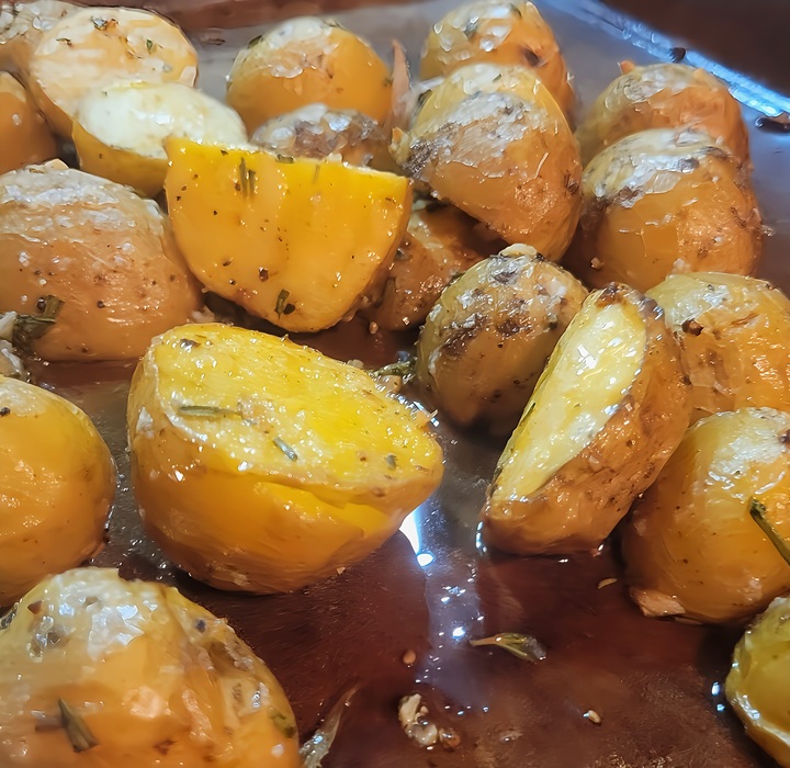 roasted baby yukon gold potatoes with herbs and oil.