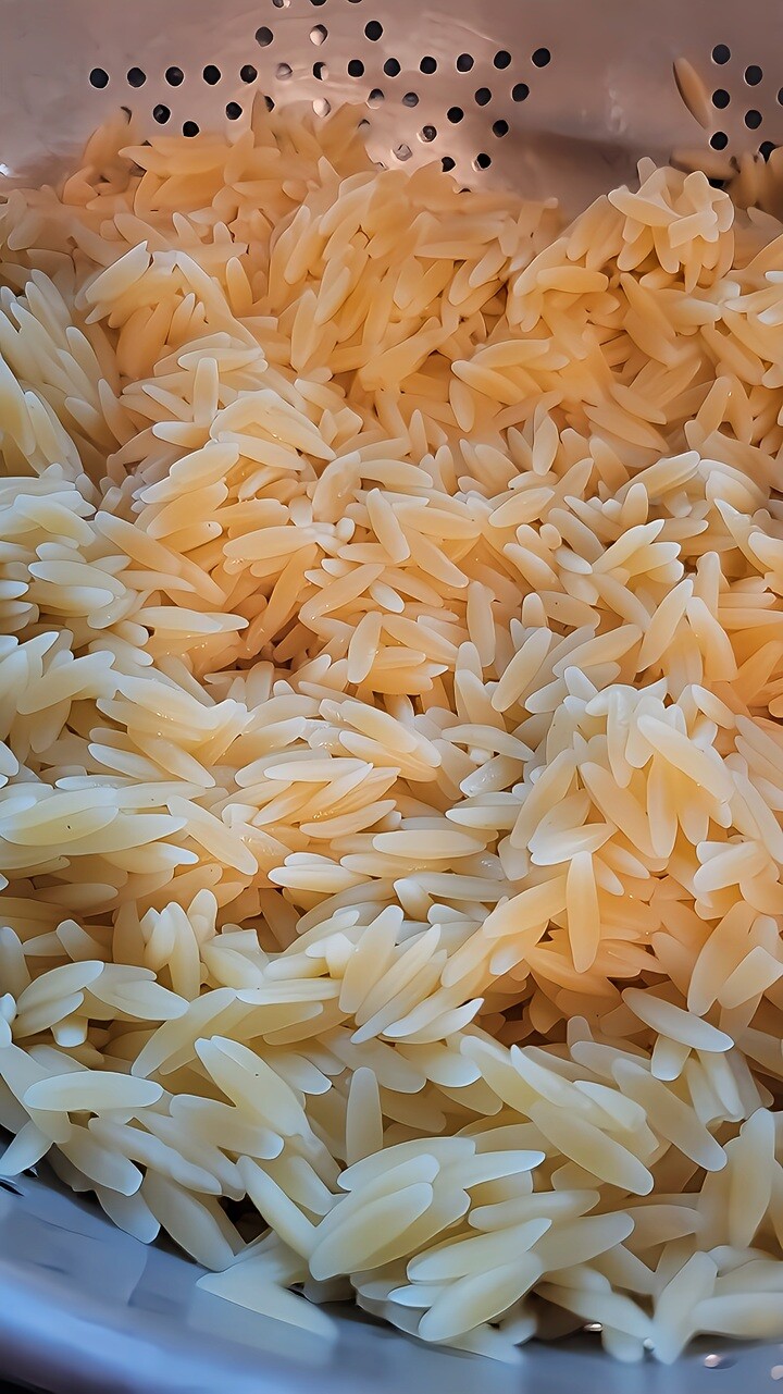 cooked orzo pasta in colander