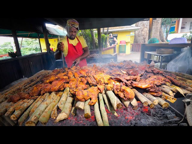 a cook in Jamaica cooking jerked meat over allspice wood.